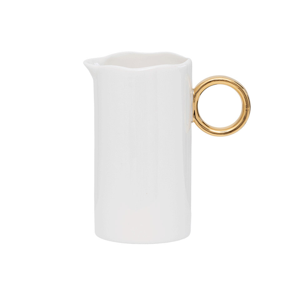 Good Morning white porcelain milkjug with wavy rim and gold ring handle.
