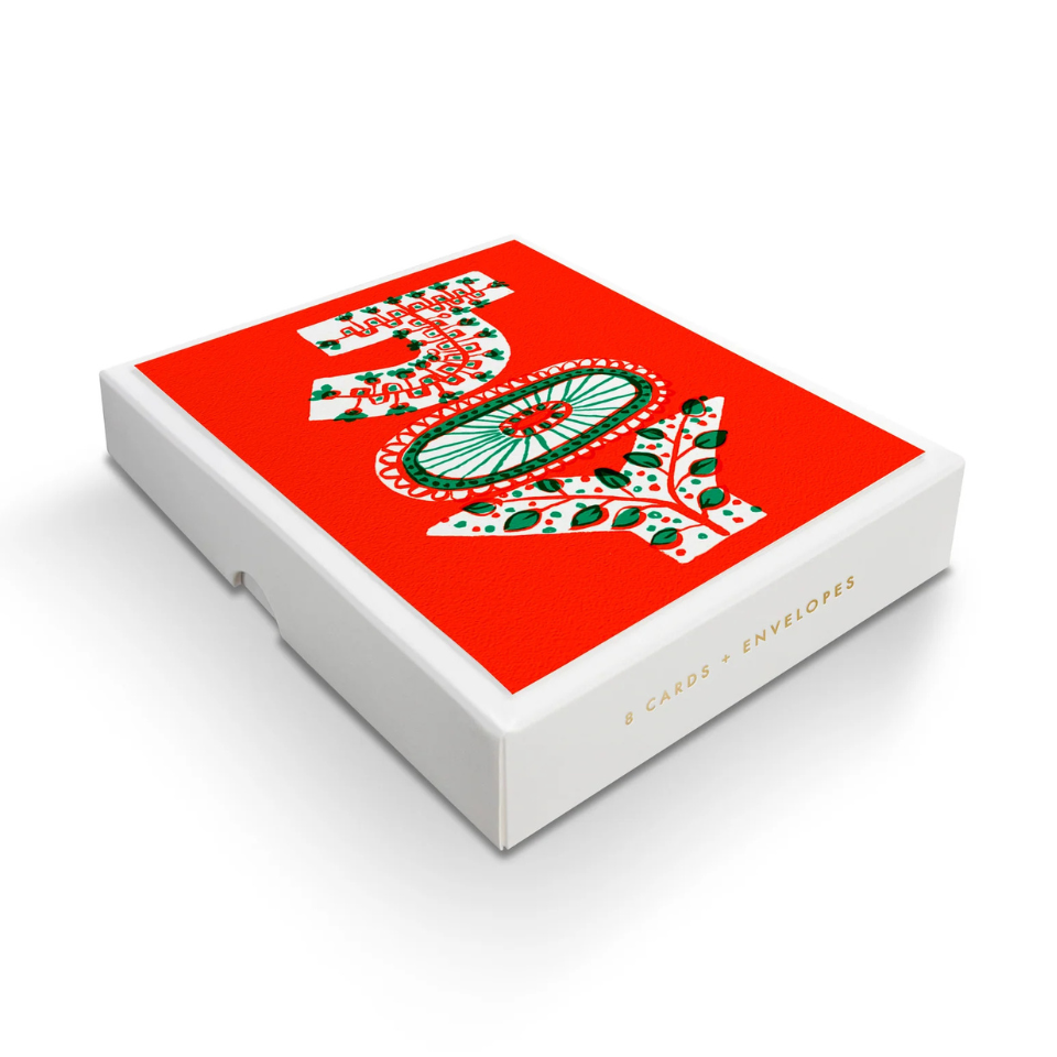 Box with decorative JOY  on a red background