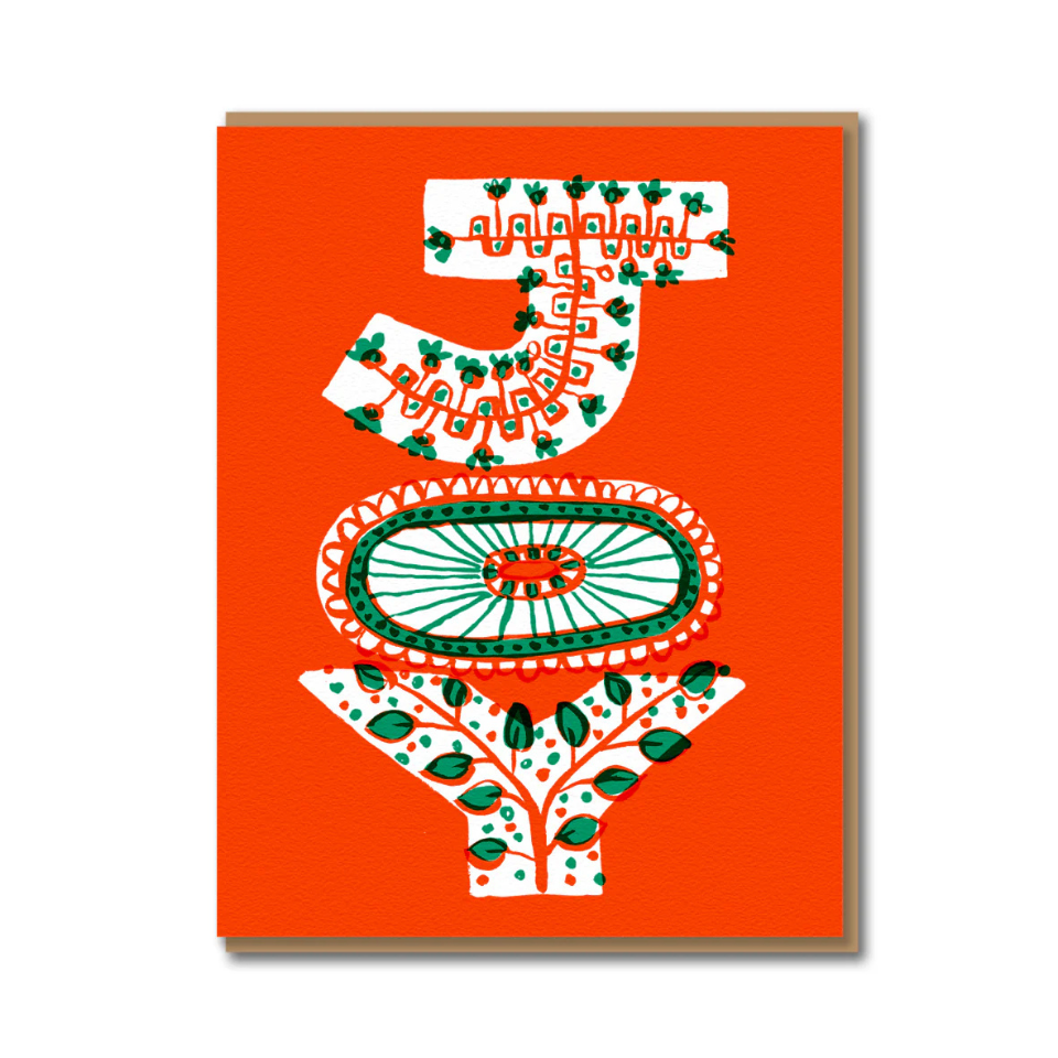 Decorative card with a stylized Joy design on a red background