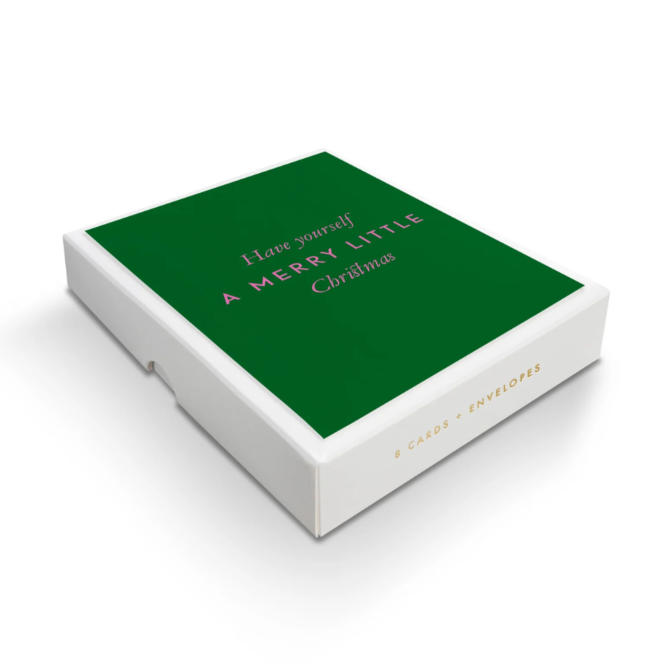 Box of Christmas cards with green front and white base on a white background
