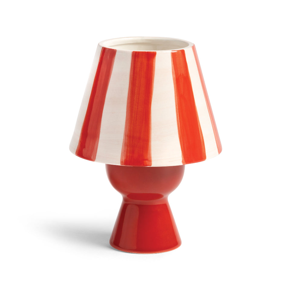 Red and white striped candle holder on a white background