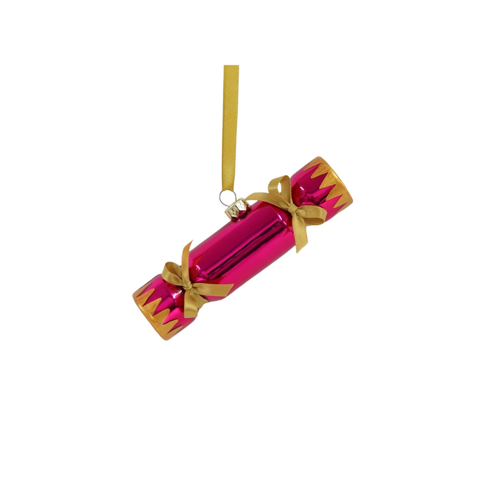 Pink Christmas cracker with gold ribbon on a white background