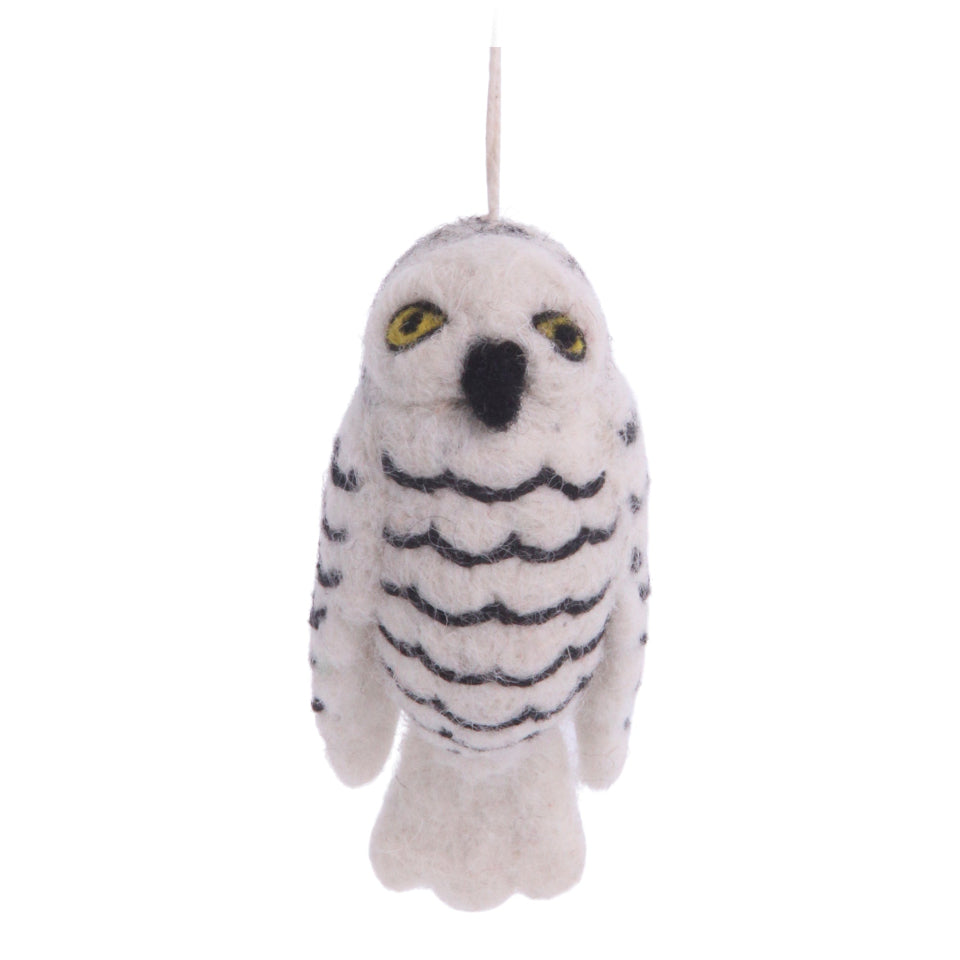 Felt owl decoration with black stripes on a white background