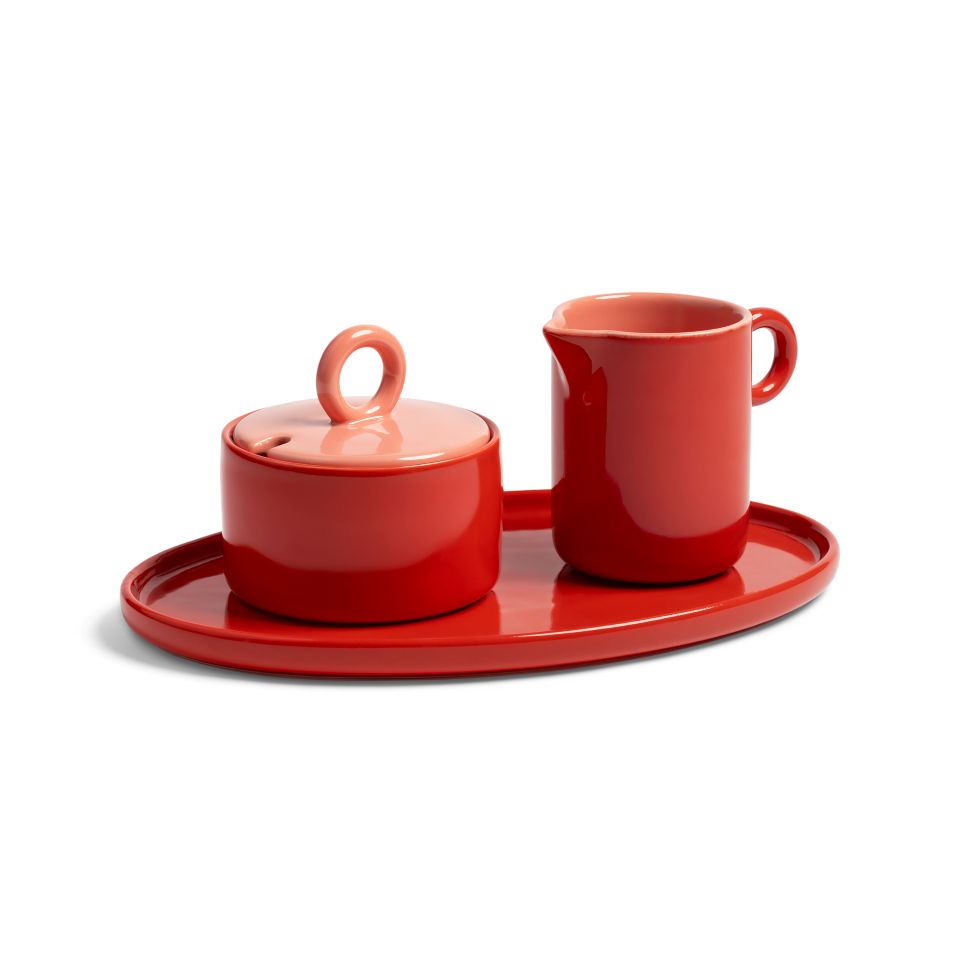 Red Ceramic jug and sugar bowl on a red tray