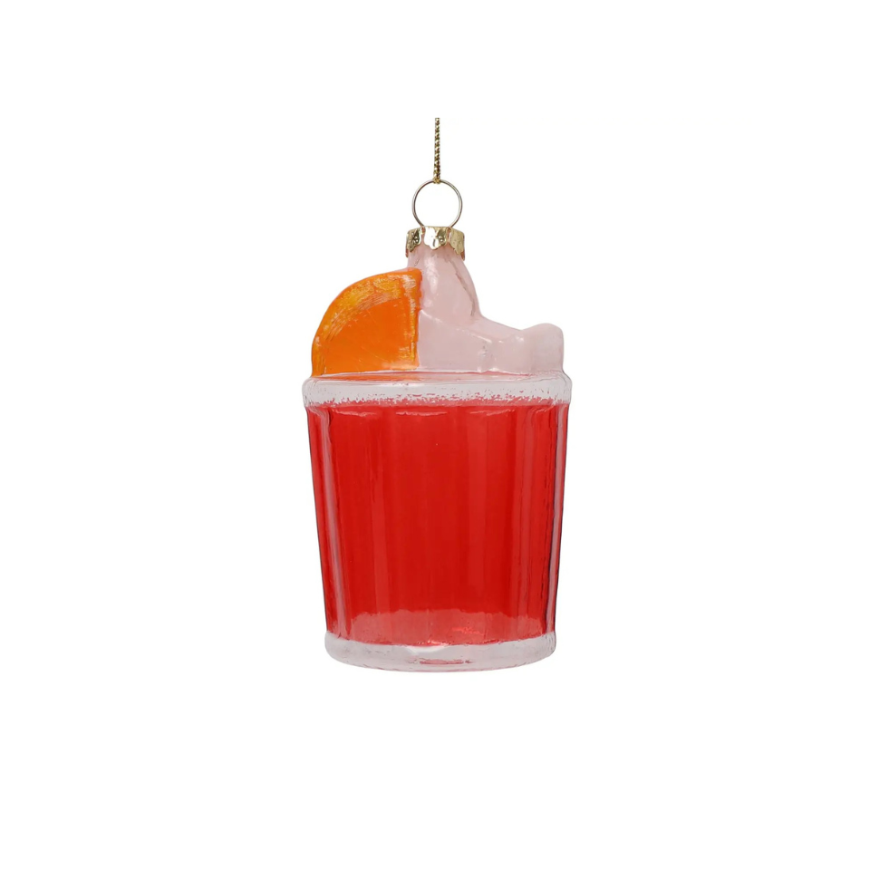 Decorative ornament shaped like a Negroni Cocktail with an orange slice on a white background