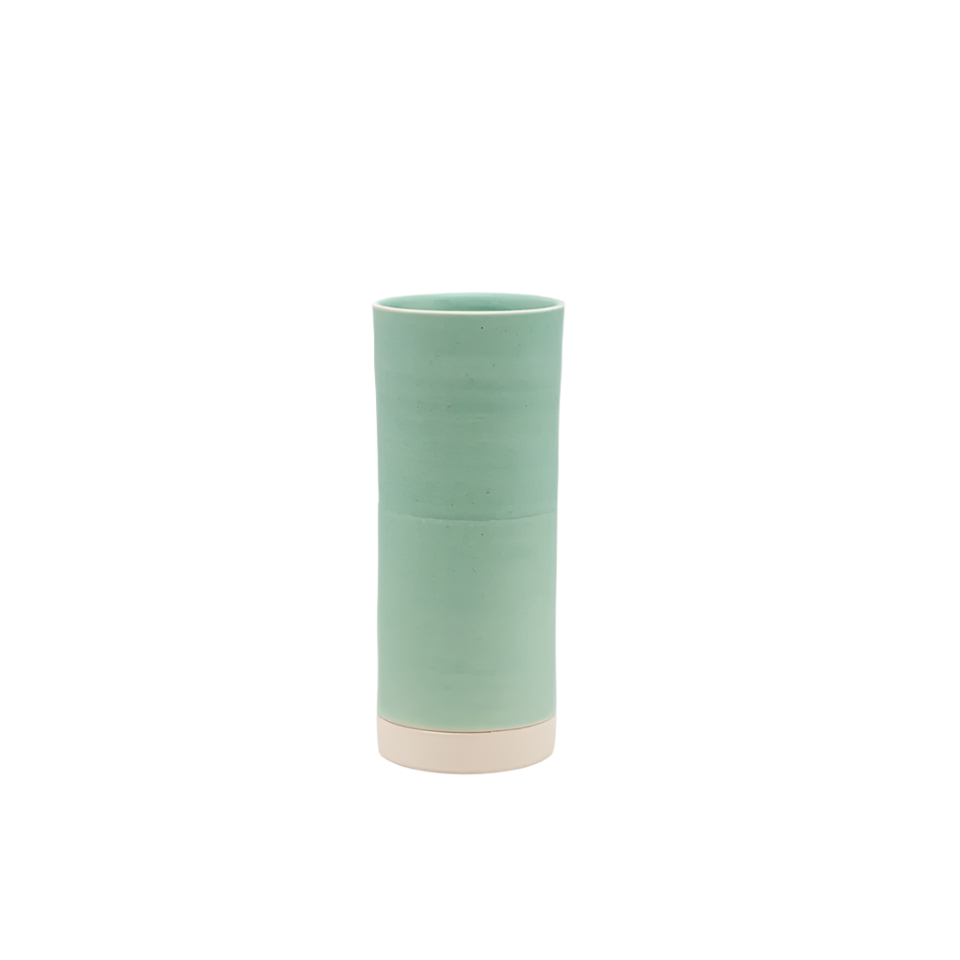 Green cylindrical vase on a white background