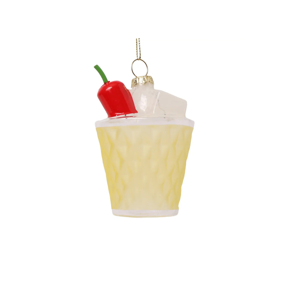 Decorative ornament shaped like a cocktail with a red pepper on top against a white background