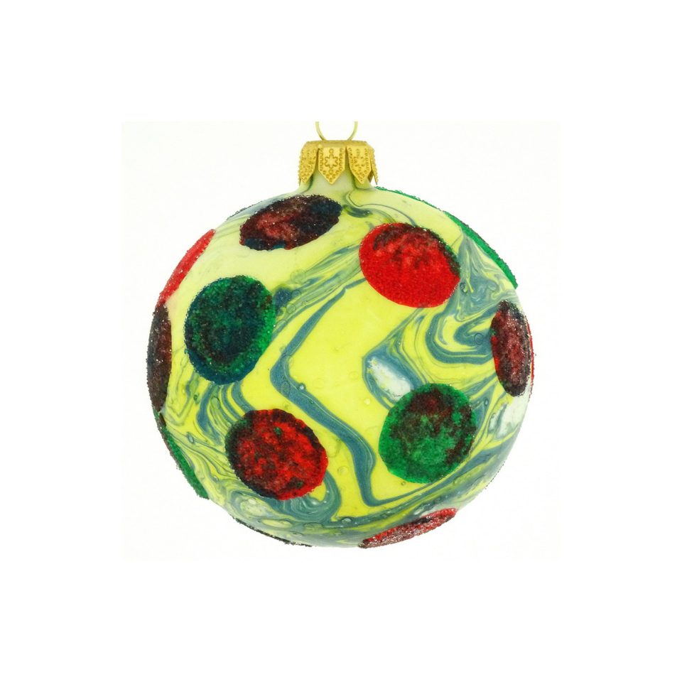 Decorative Christmas ball ornament with red and green polka dots on a white background