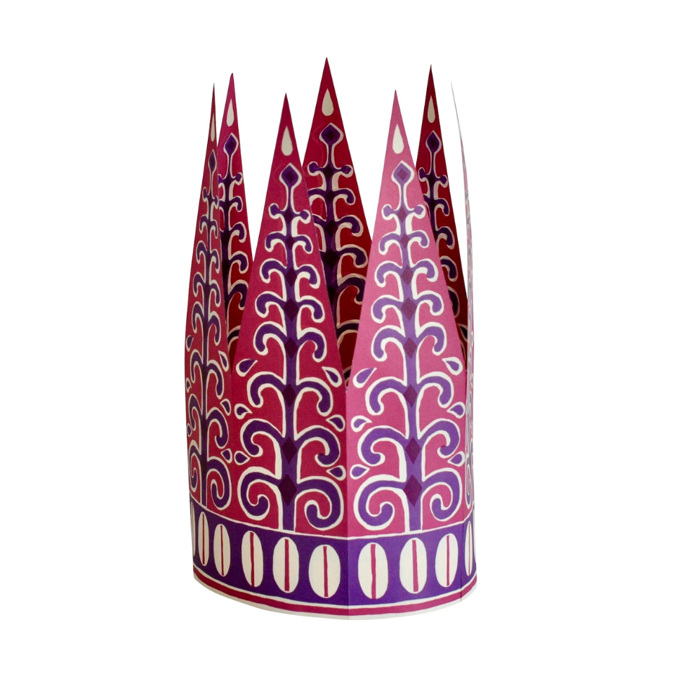 Decorative paper crown with intricate purple and red patterns on a white background