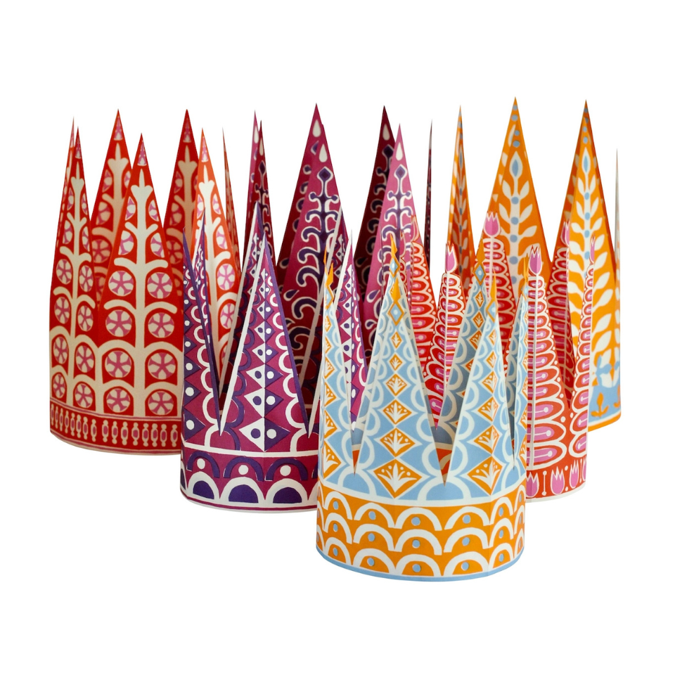 Set of colorful paper party hats with geometric patterns on a white background