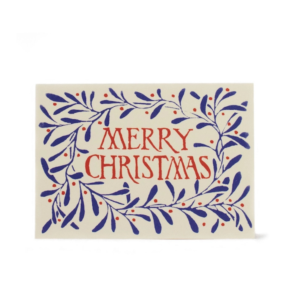 Merry Christmas card with blue leaves and red text on a white background