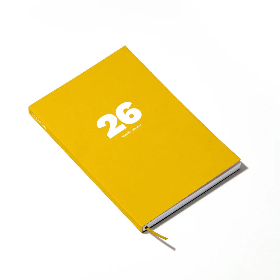 Yellow weekly planner with bold 26 printed on the front