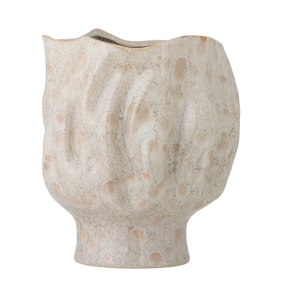 Textured ceramic vase on a white background
