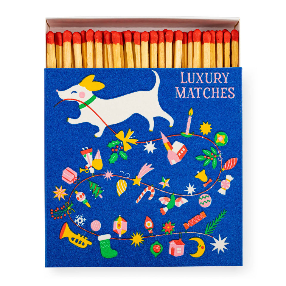 Matchbox with decorative design and 'Luxury Matches' text on a blue background