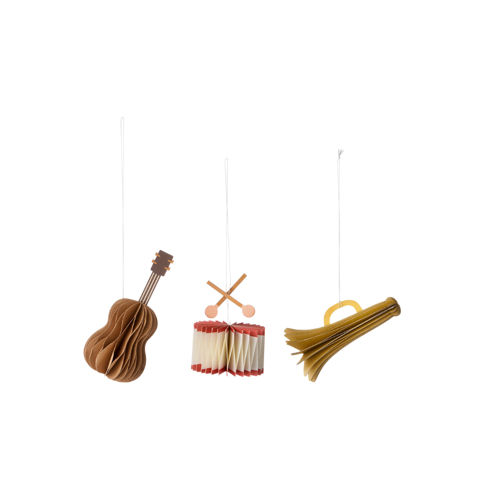 Three hanging musical instruments on a white background