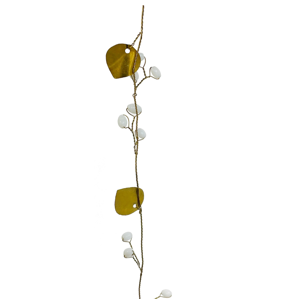 Decorative vine with gold leaves and white berries on a white background