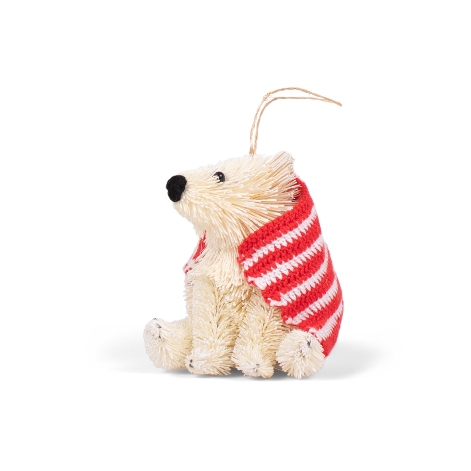 Decorative bear ornament with a red and white striped scarf on a white background