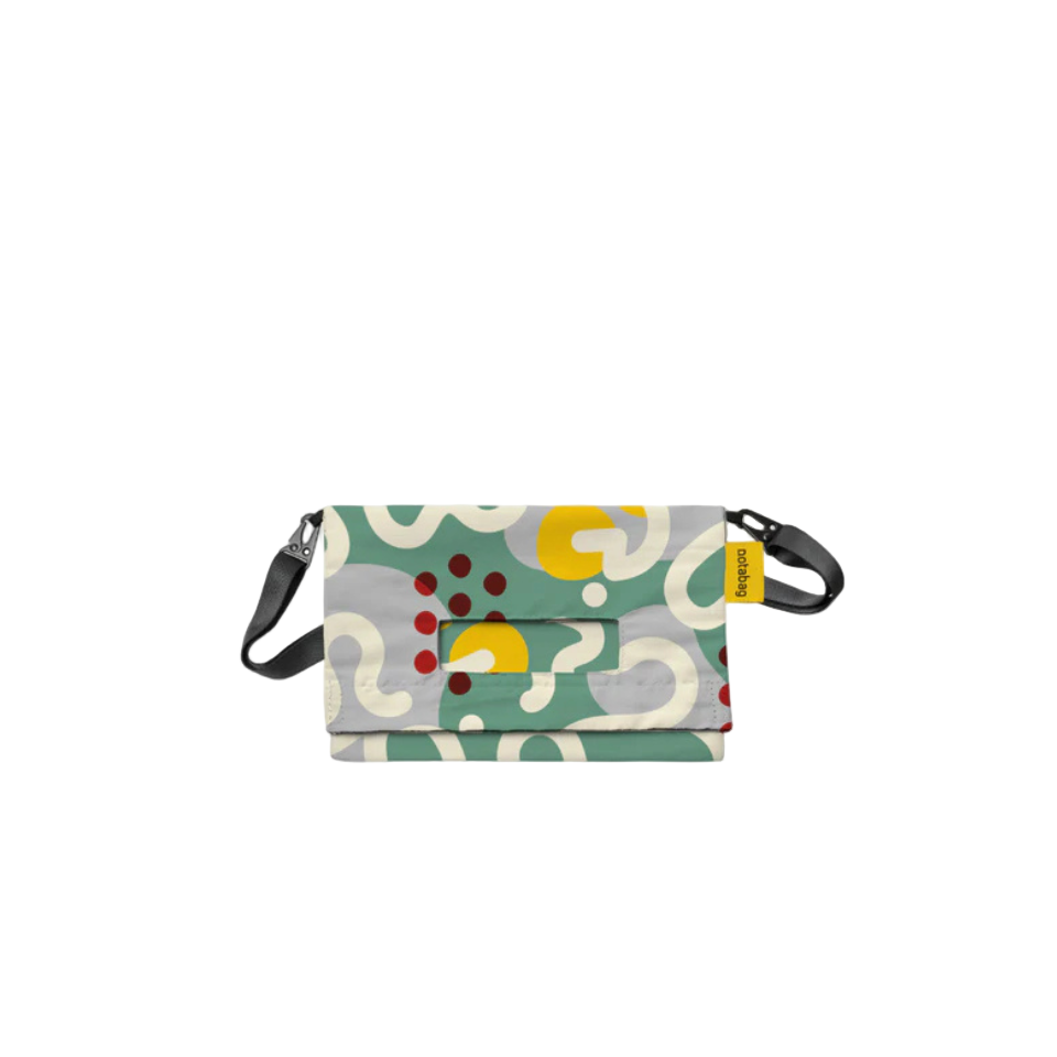 Multicolored patterned bag with a strap on a white background
