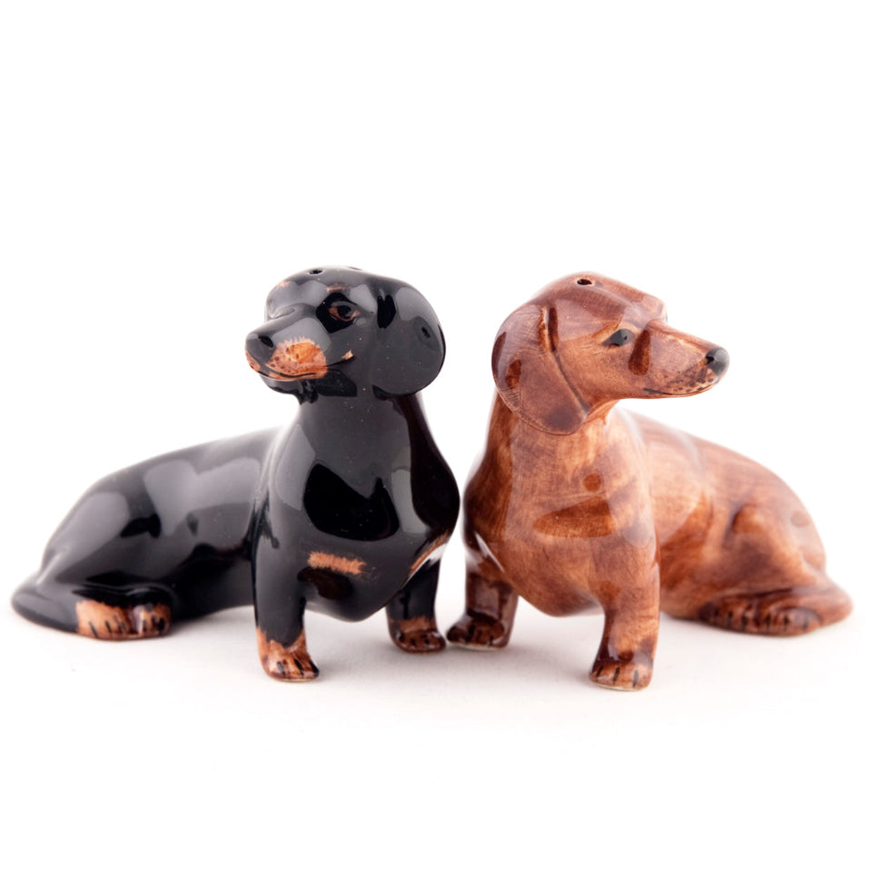 Black and brown dog-shaped salt and pepper shakers on a white background