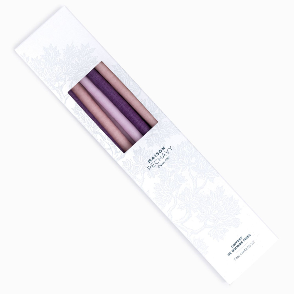Box of fine taper candles in shades of pale pink and purple