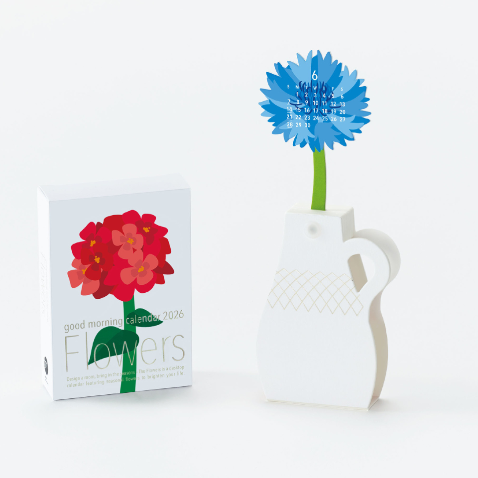 Calendar with floral design and a blue flower in a white vase on a white background
