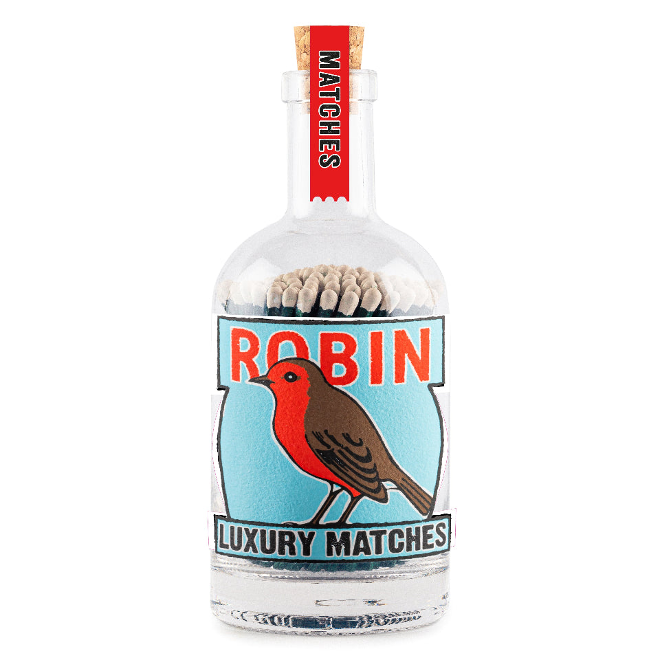 Matches in a bottle with a robin design on a white background