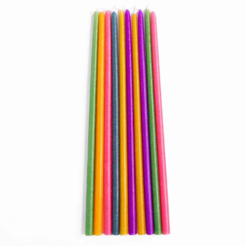 set of 10 brightly coloured candles in shades of yellow, green, pink, purple and blue.