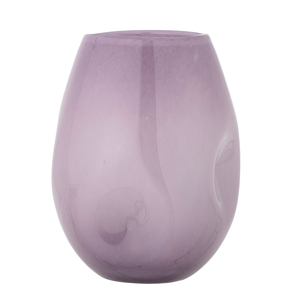 Purple glass vase on a white background