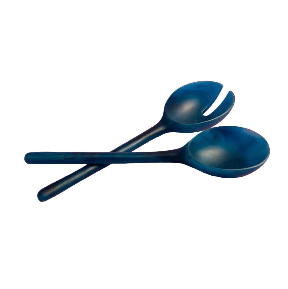 Two blue spoons on a white background