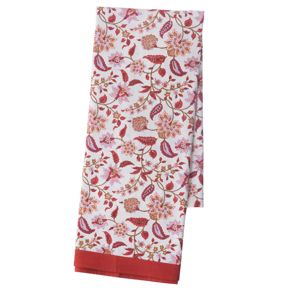 Floral patterned tablecloth with red border on a white background