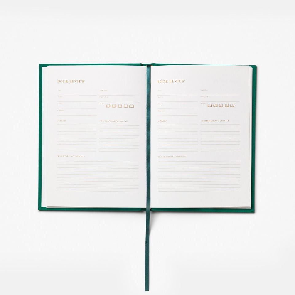 Open notebook with green binding on a white background