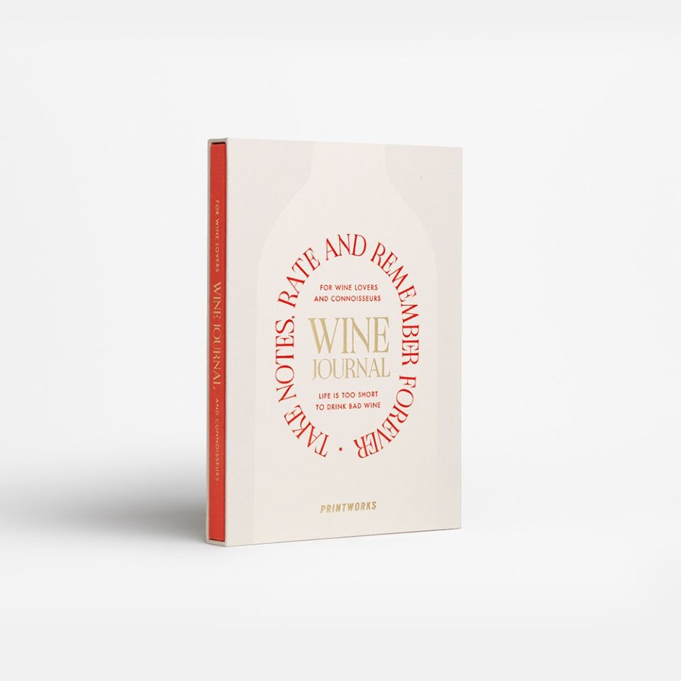 Wine journal with red and gold text on a white background