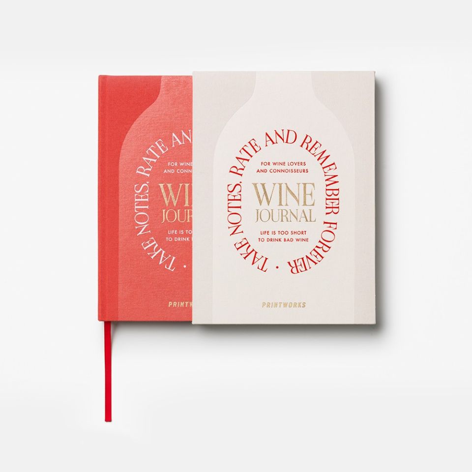 Wine journal in a slip cover with red and beige covers on a white background