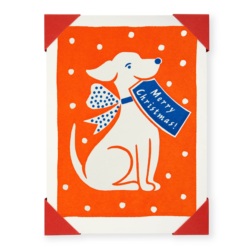 Christmas card with a dog holding a 'Merry Christmas!' sign on an orange background