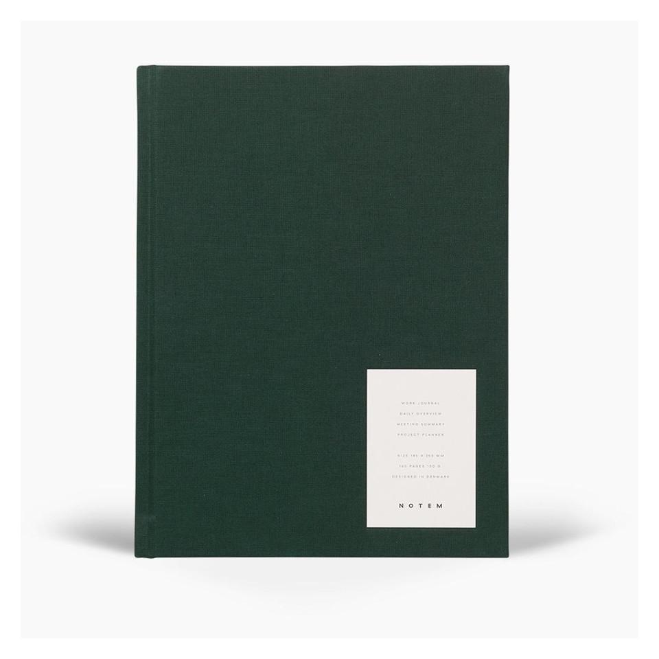 Even work journal with dark green fabric hardcover.