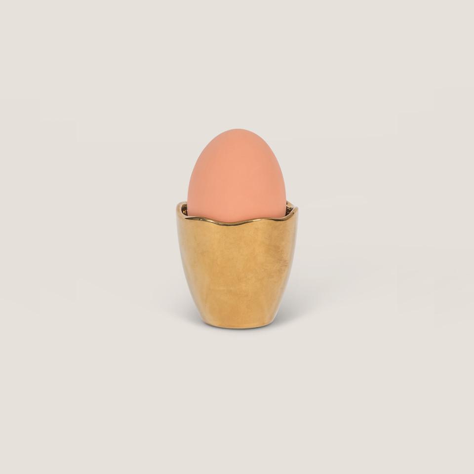 Good Morning gold eggcup styled with an egg.