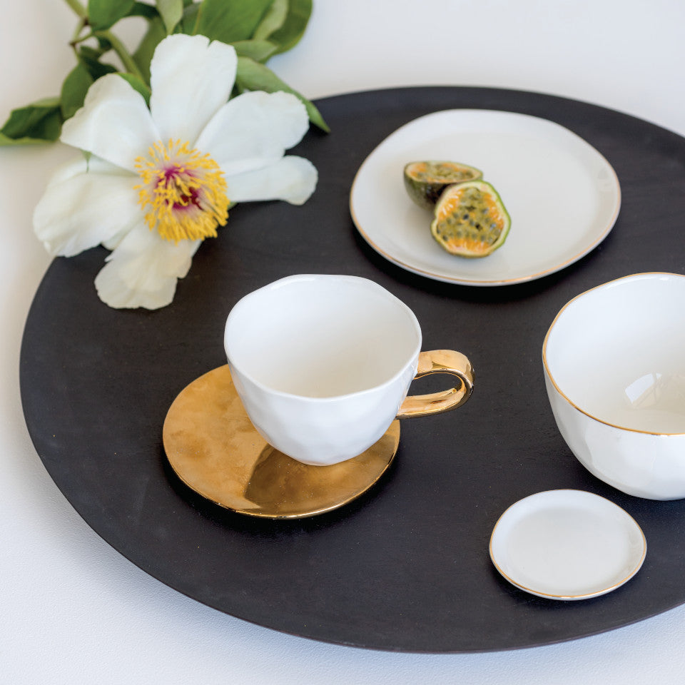 Good Morning gold plate, styled with Good morning white cup, bowl, small and large plates..