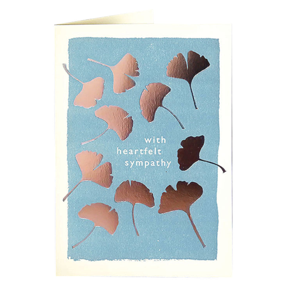 With Heartfelt Sympathy, blank card, with gold gingko leaves on a pale blue background, with white envelope.