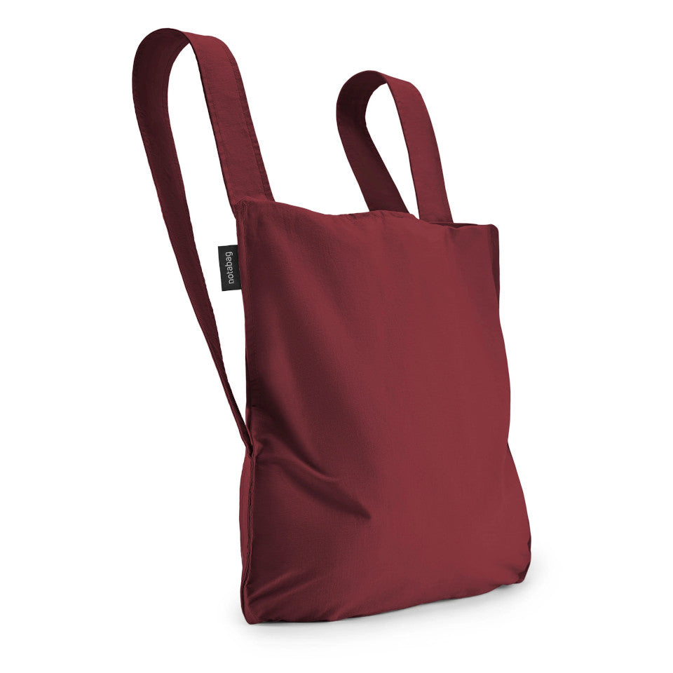 Not-a-bag re-usable fold-away pouch, wine, shown as backpack.