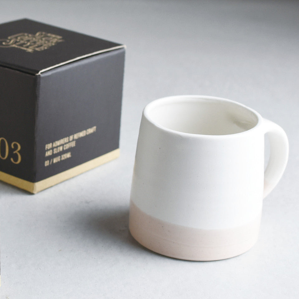 SCS (Slow Coffee Style) S03 white / pink coffee mug with box in the background.