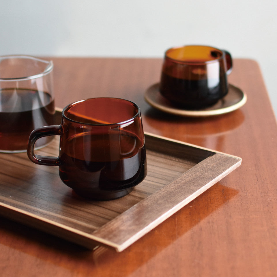 Sepia glass mug, styled with Sepia teacup and teak saucer.