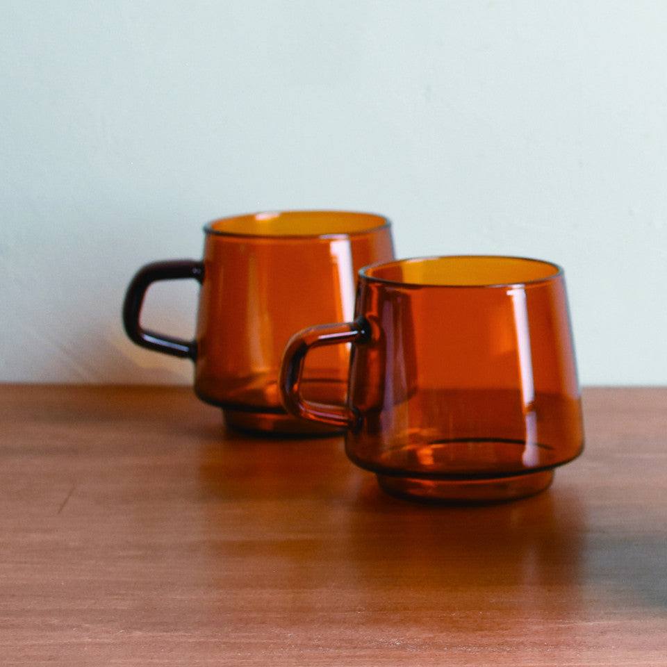 Sepia glass mug, styled.