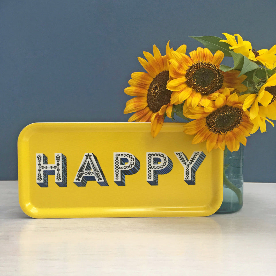 HAPPY by Asta Barrington, oblong tray, 32 cm x 15 cm, styled with sunflowers.